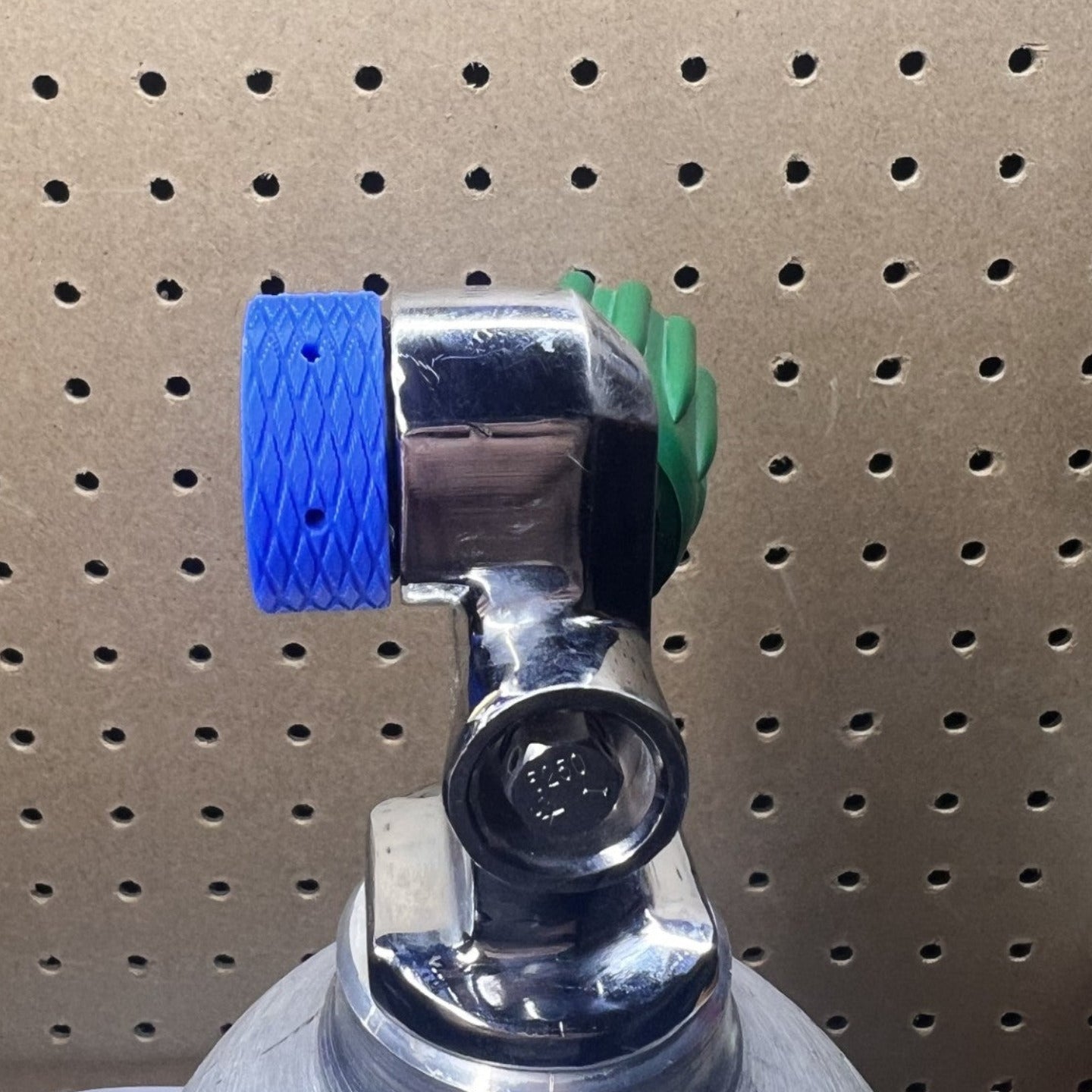 Blue Din Cap installed in SCUBA tank