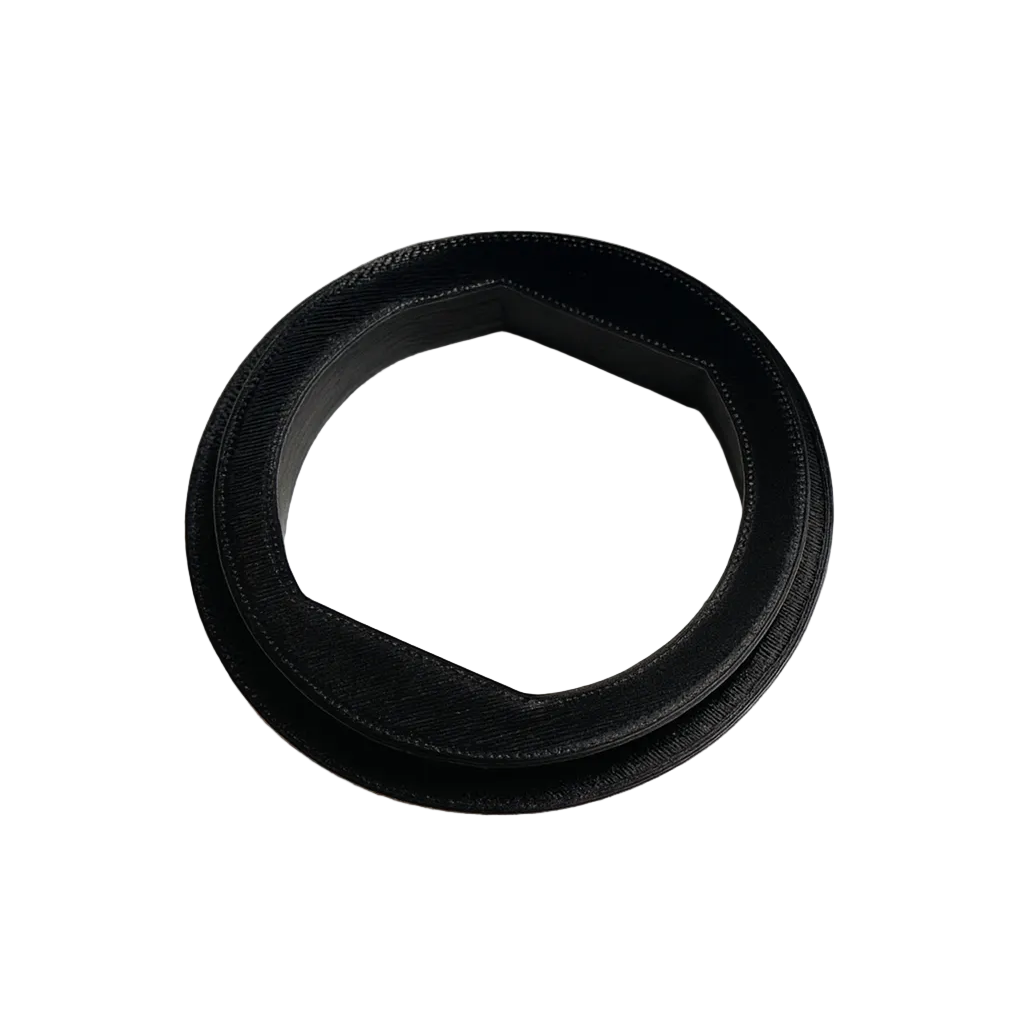 Black rubber gasket on a textured white background